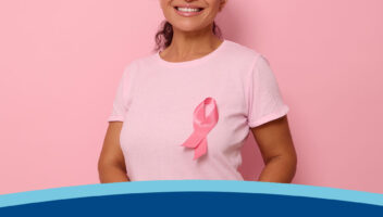 Lady Representing Breast Cancer awareness by wearing pink ribbon