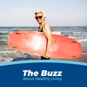 Mature woman with a surfboard and exercising